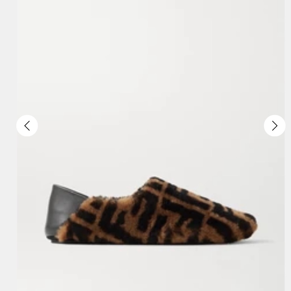 Fendi Leather trimmed logo print collapsible heel slippers. Sheep died fur Italy